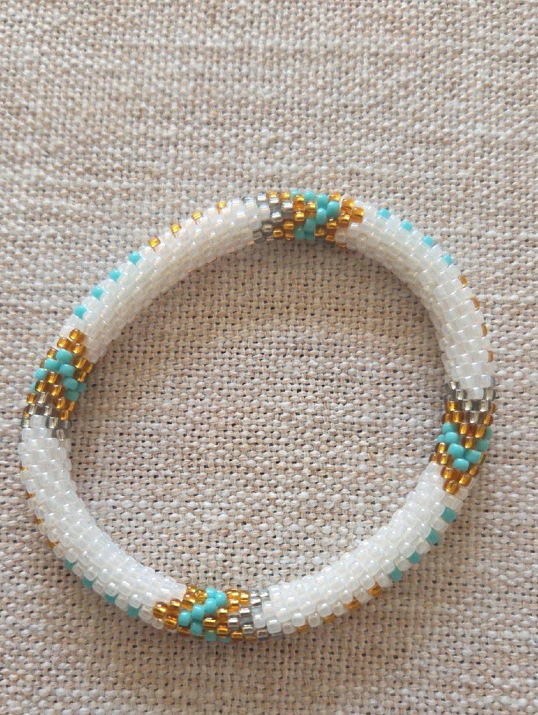 Sashka Co. White Seed Bead Bracelet With Turquoise, Gold And Gray Accent.